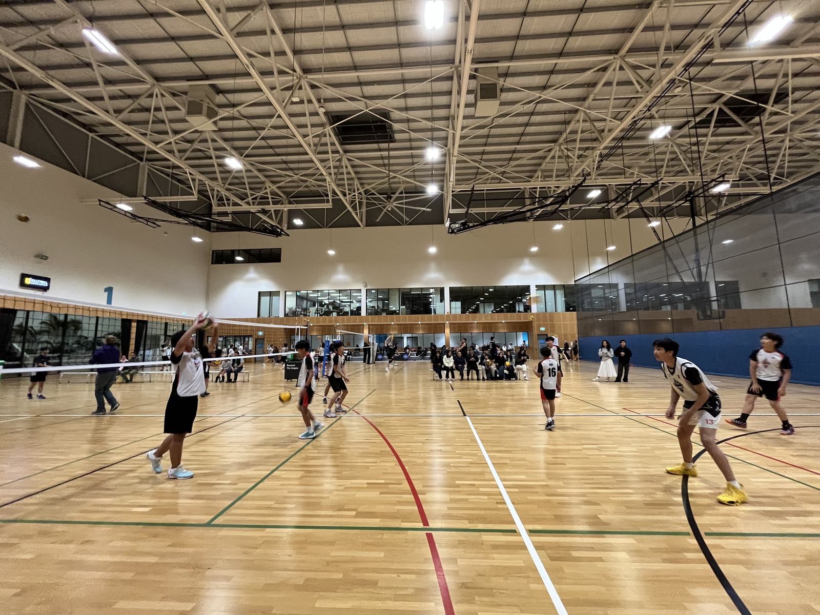 Junior players mid-rally during a match