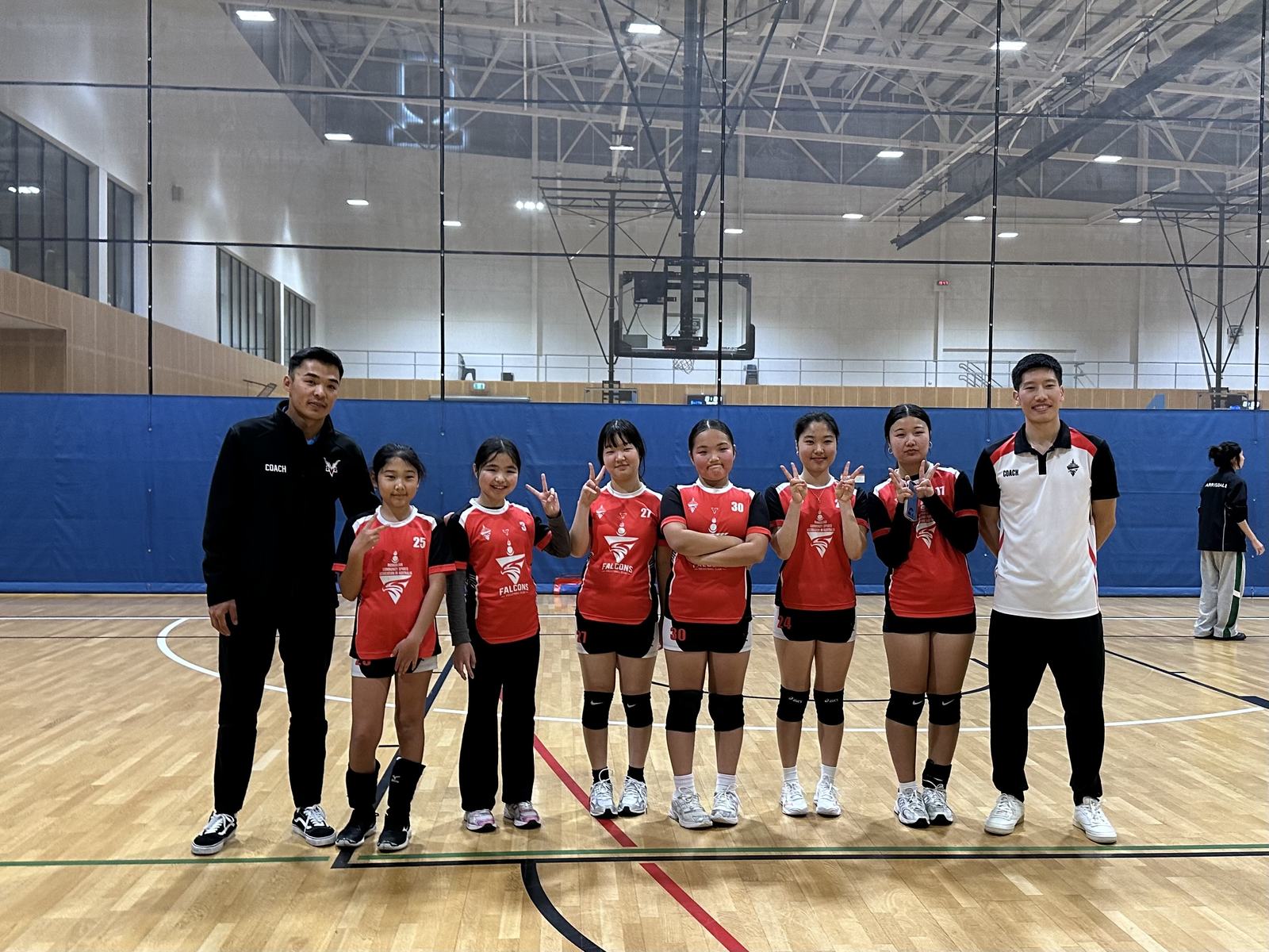 Falcons junior girls team group photo with coaches